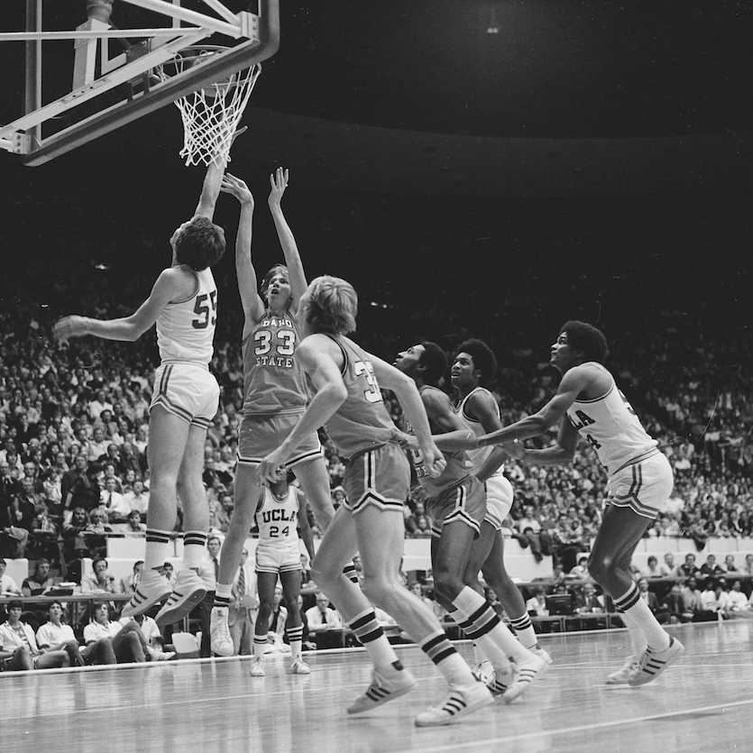 ISU and UCLA players under the hoop as center Steve Hays attempts shot.