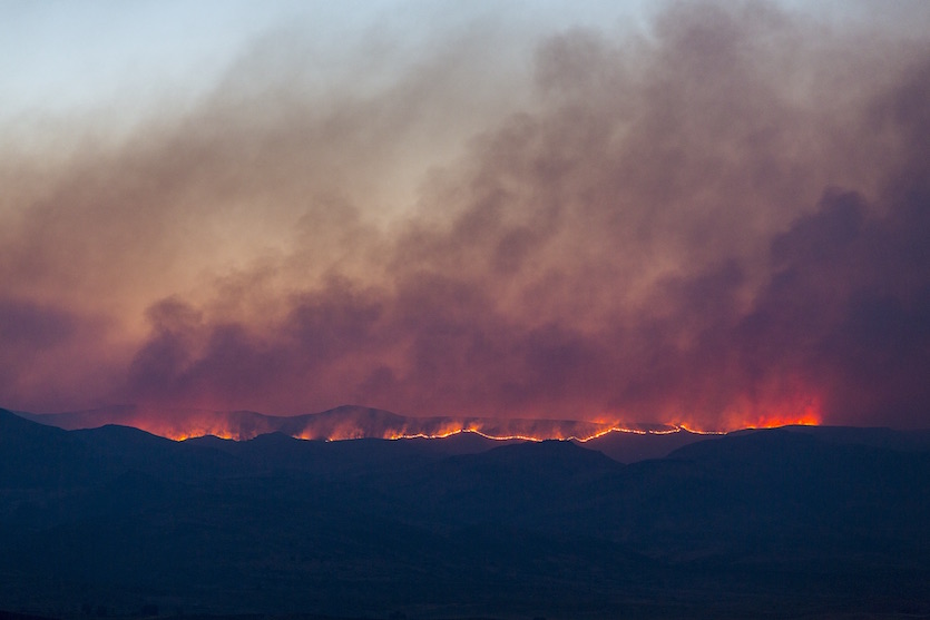 A photo of the wildfire burning a hillside during the Soda Fire.