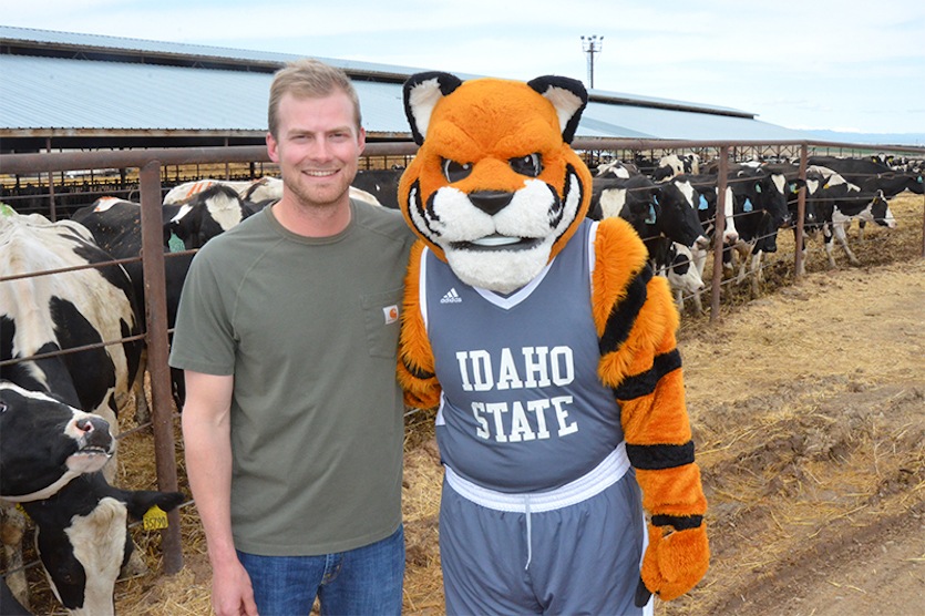 Benny the Bengal with a dairy farmer