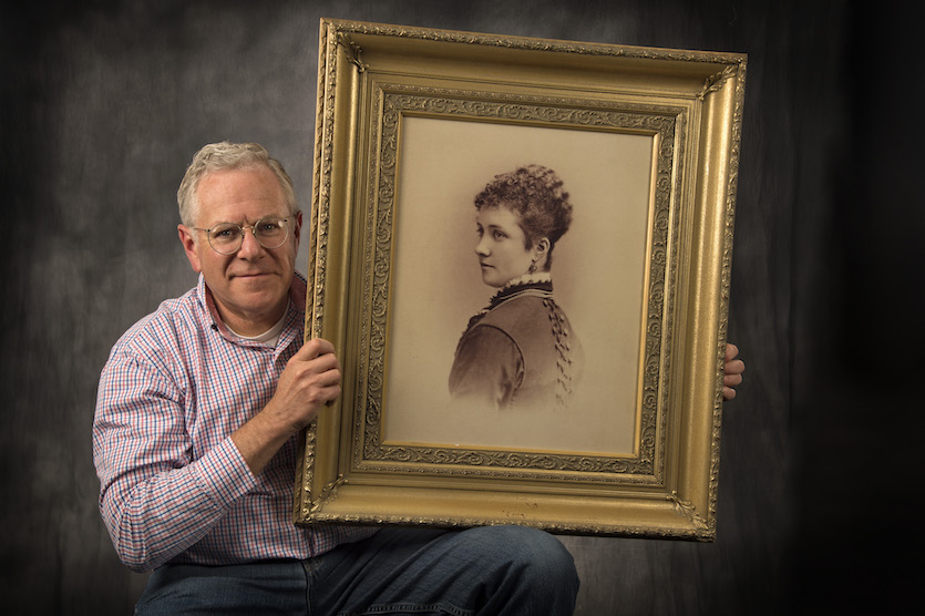 Phil Homan with portrait of Kittie Wilkins