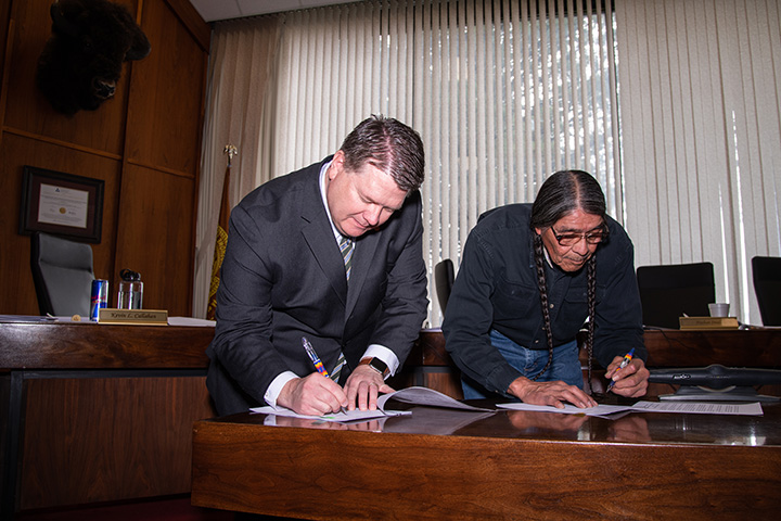 Kevin Satterlee and Nathan Small sign a Memorandum of Agreement