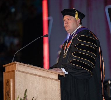 President Satterlee addressing crowd at commencement