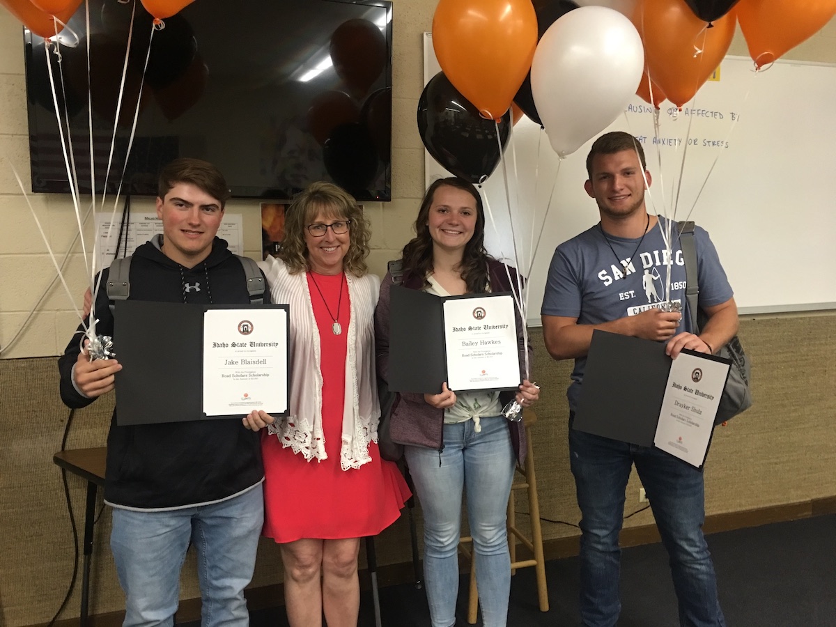 Three scholarship winners with dean Turley-Ames