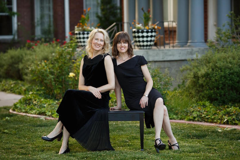 The two Bond sisters sitting on a bench. 