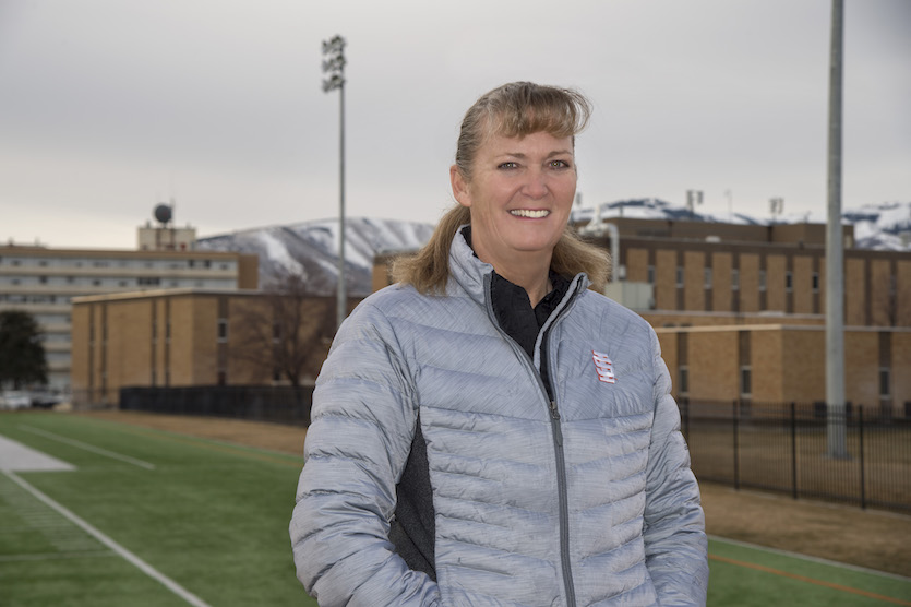 Photo of Caroline Faure with buildings in the background.