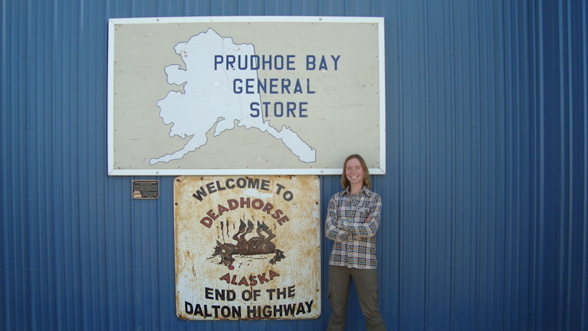 Photo of student Caitlin Rushlow standing in front of the Prudhoe Bay General Store in Alaska.