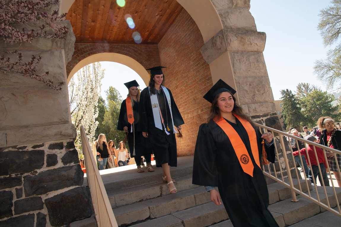 Students marching through the Swanson Arch during spring 2019 ceremony.
