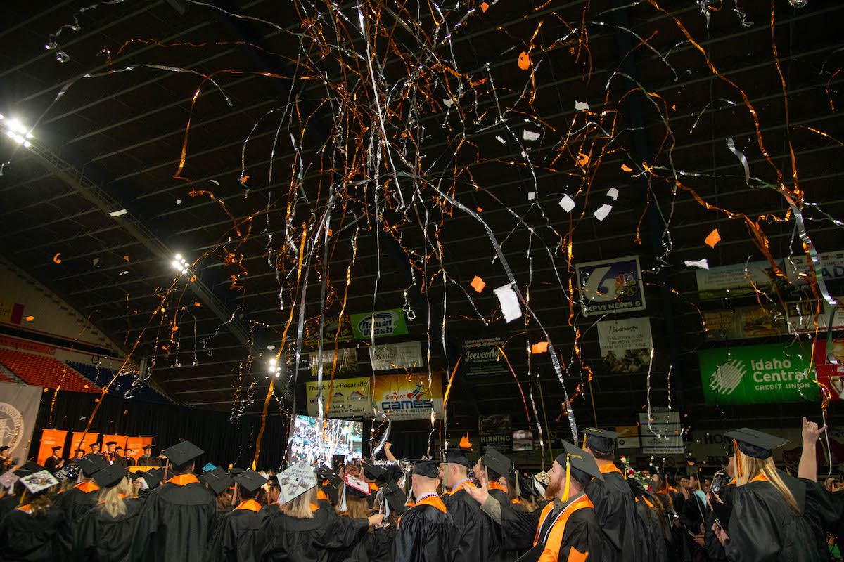 Streamers following on graduates at end of ceremony.