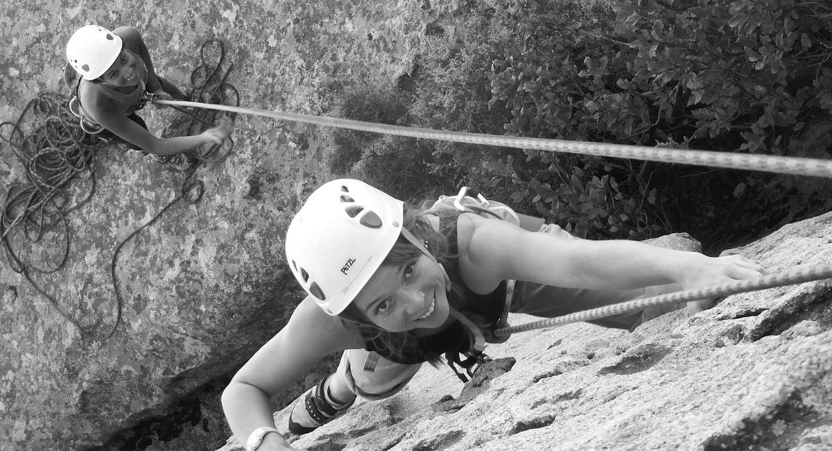 Young girl rock climbing