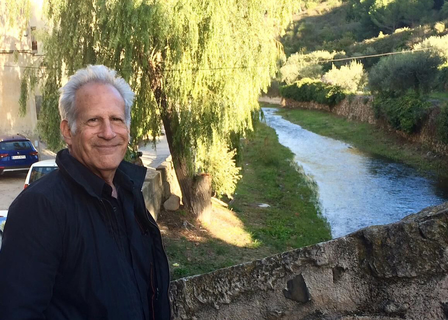 Author Arthur Dorros standing near a river.