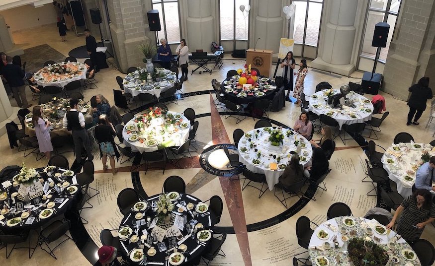 Photo of layout of Opportuni-Tea tables taken from above at the Stephens Performing Arts Center