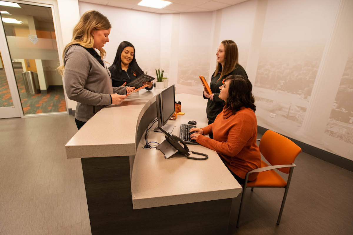 People in reception area of new welcome center.