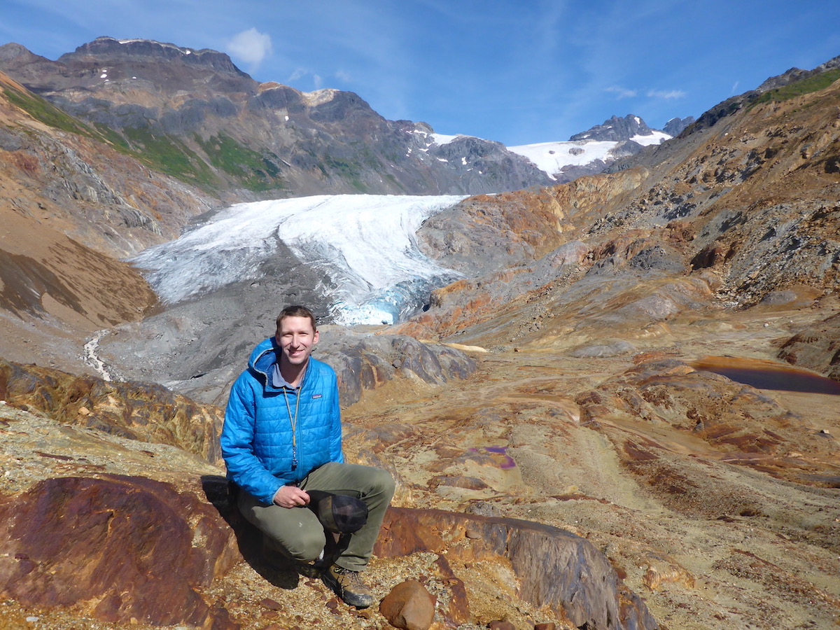 Professor Pearson in mountains with glacier in the background
