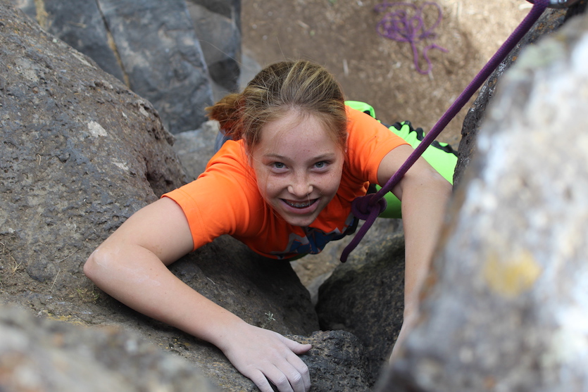 Photo of a girl rock climbing at a previous Pocatello Pump.