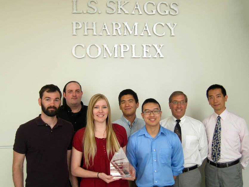 College of Pharmacy research team holding award. 