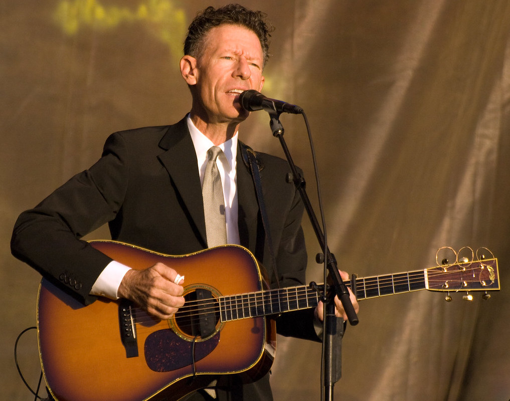 Lyle Lovett playing guitar