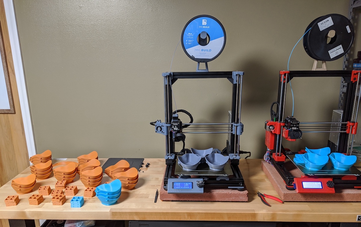 An ISU 3D printer with the PPE equipment it has produced.