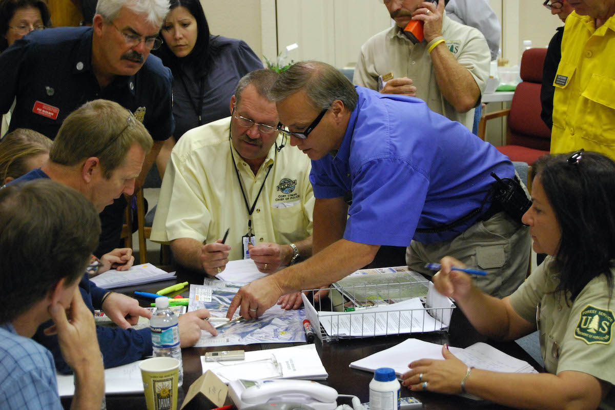 Emergency managers doing a table-top exercise.