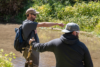 Ernest Keeley, left, directing a student during a study on the lower Portneuf River. 