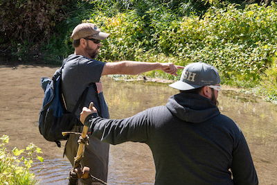 Ernest Keeley, left, directing a student during a study on the lower Portneuf River.
