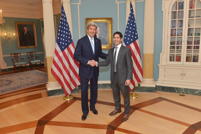 A photo of keynote speaker Steven Feldstein with former Senator and Secretary of State John Kerry.
