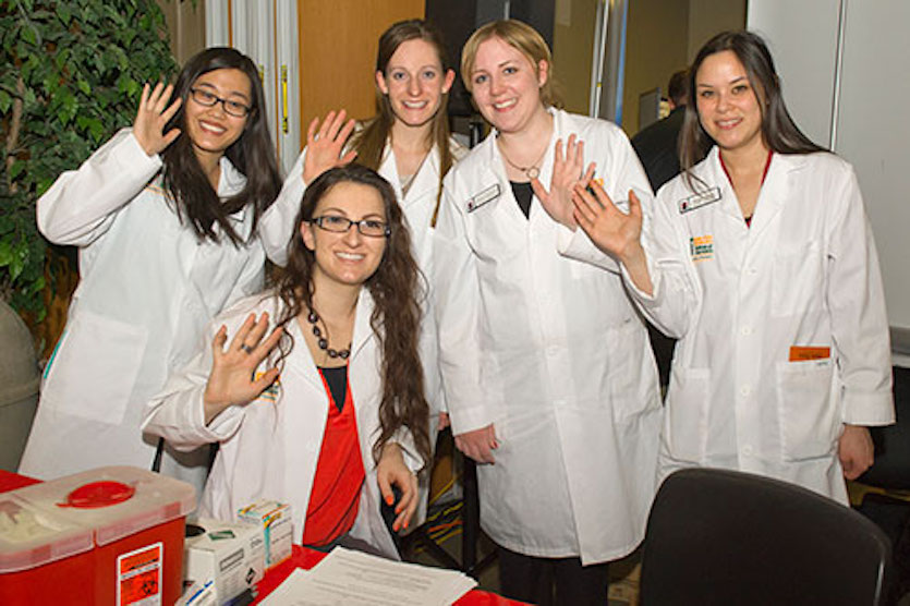  Photo of student scholars in white jackets