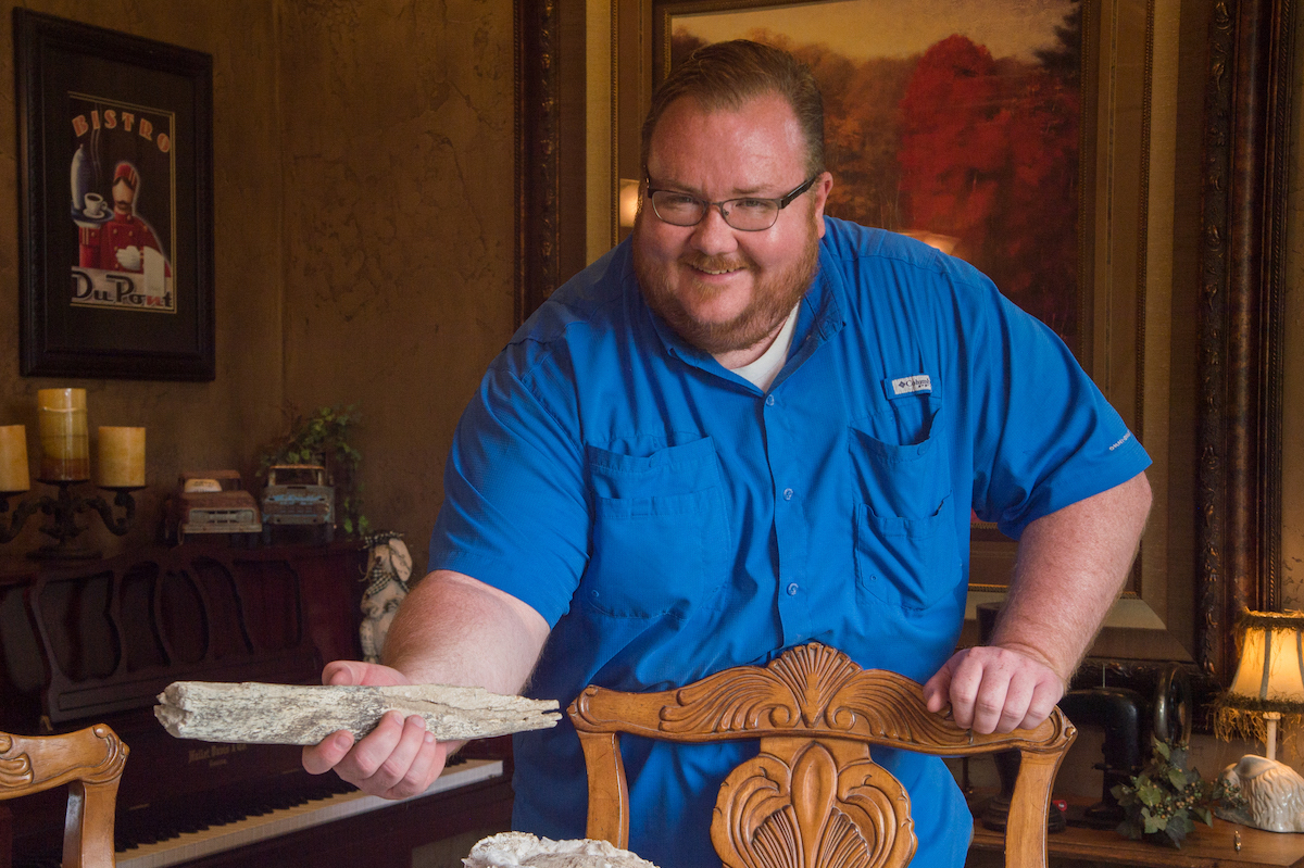 Professor Speers holding a mammoth bone.