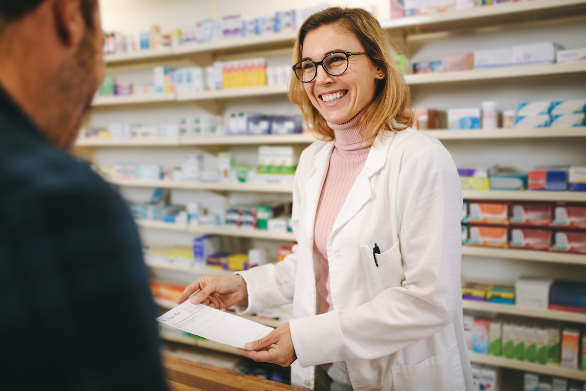 Pharmacist smiling.