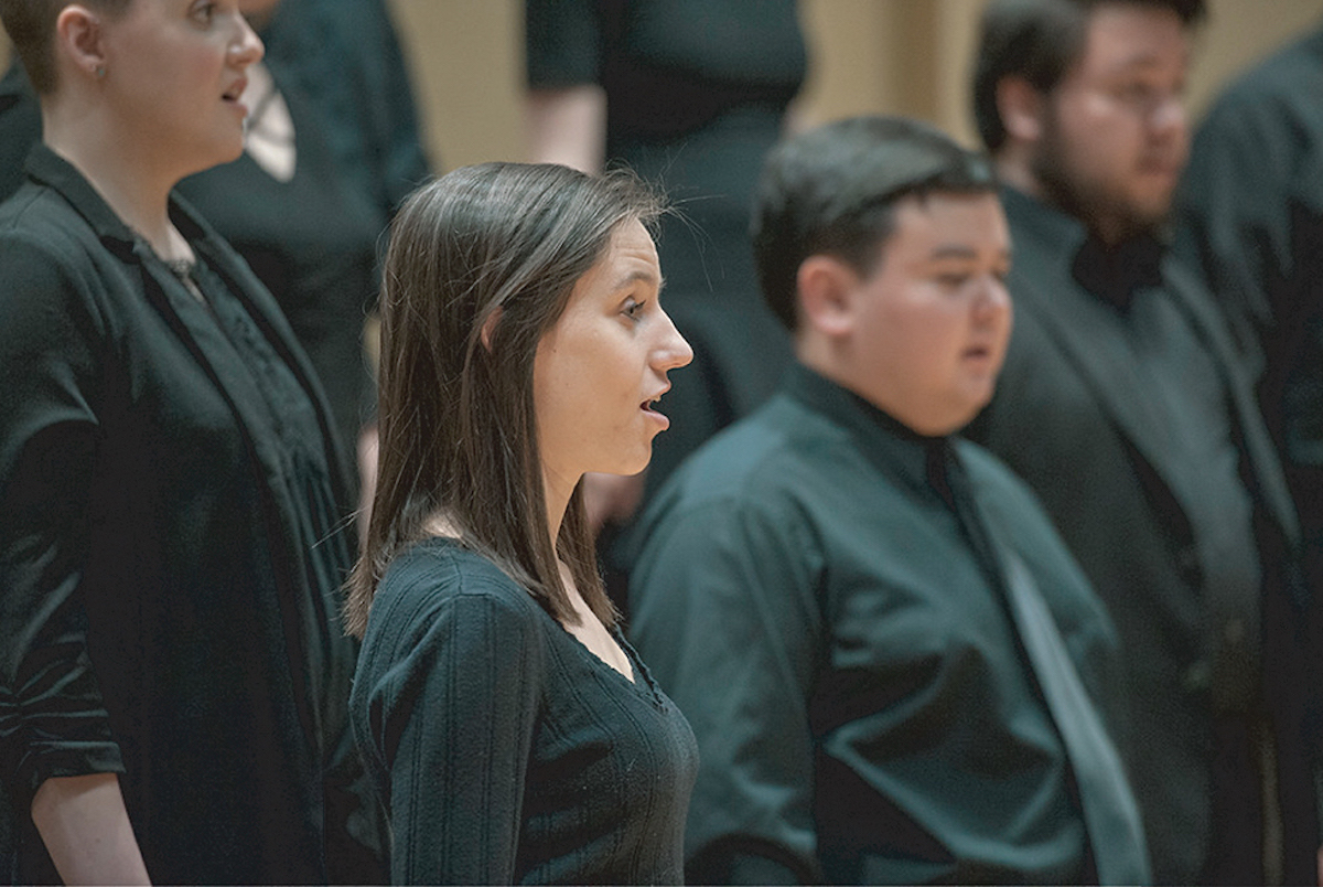 Several choir singers on stage