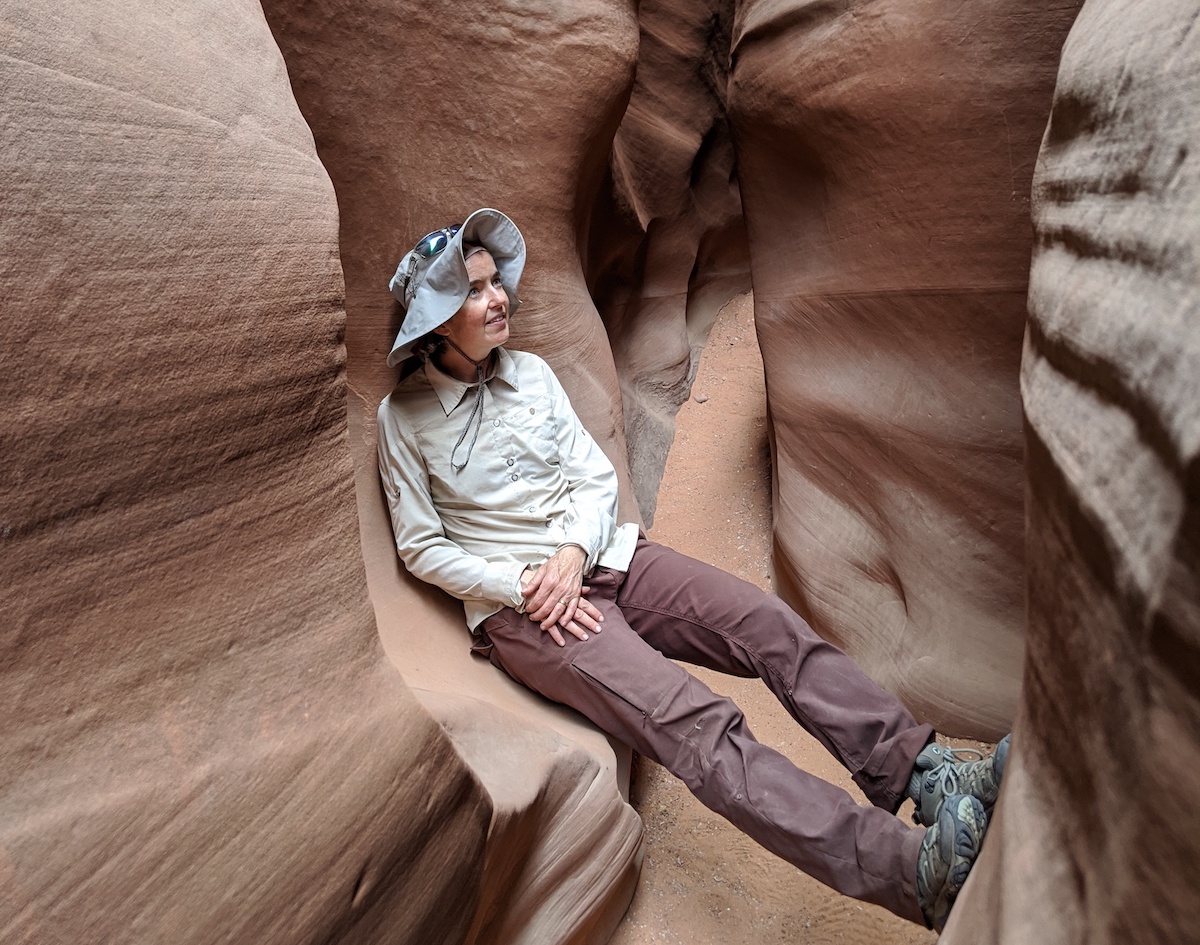 Sarah Godsey kicking back in a slot canyon.