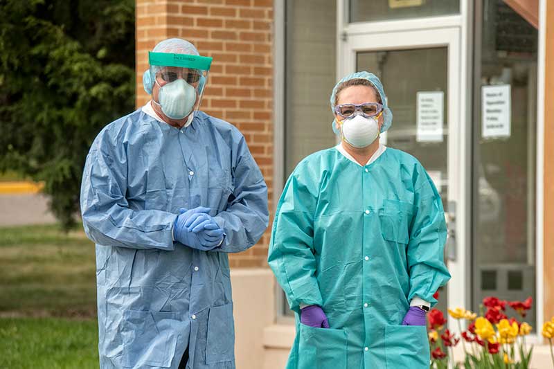 Volunteer workers wearing protective equpiment