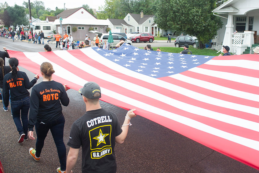 ROTC student carry the flag in a parade