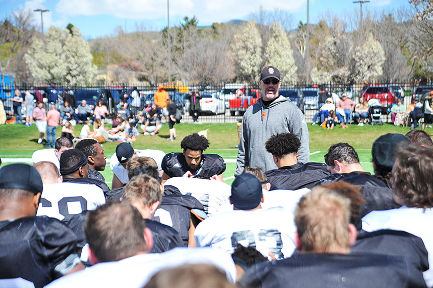 Mitch Gueller coaching a football team