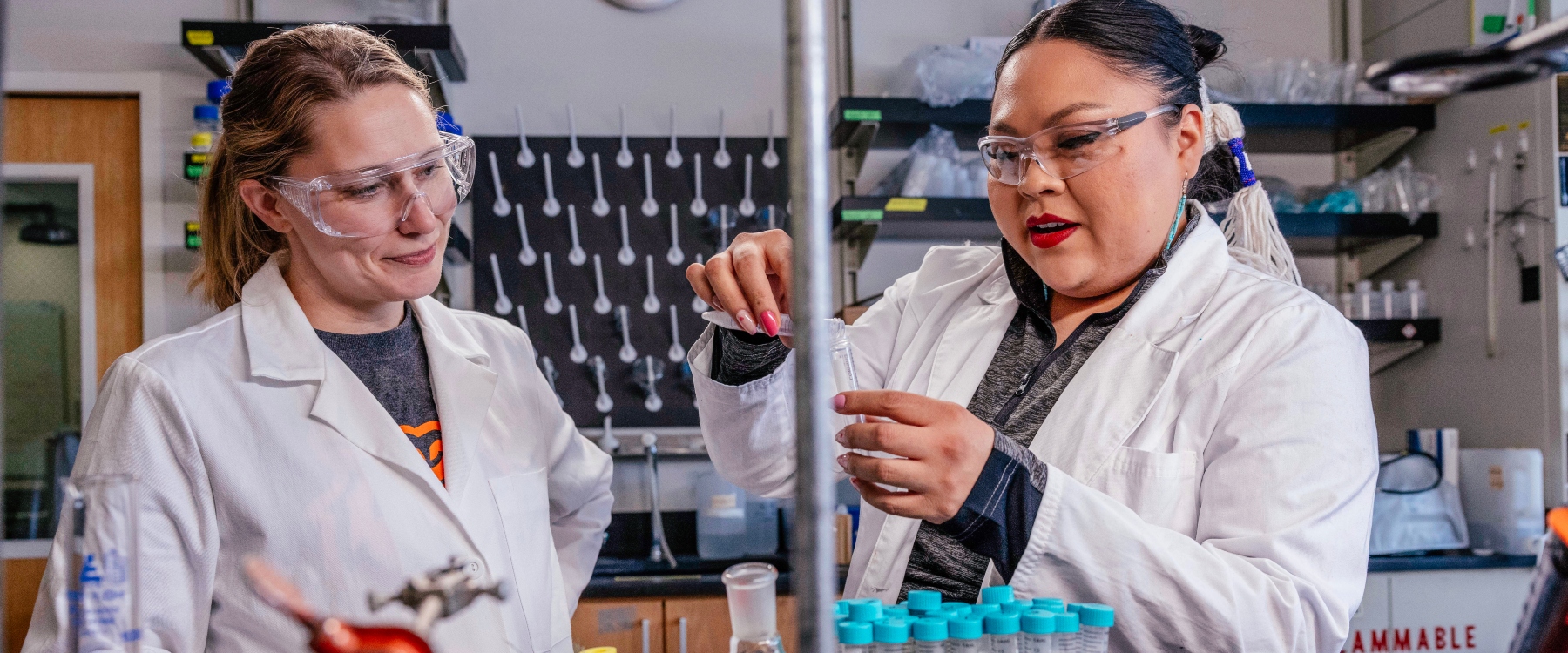 Miller (right) and Chemistry Professor, Cori Jenkins, Ph.D. (left) work together in the lab to develop renewable adhesives.