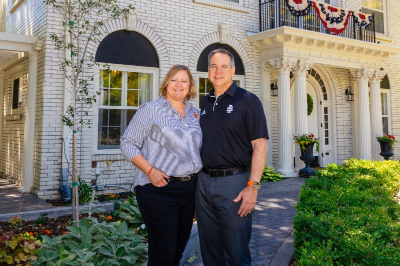 President Wagner and Tracy in front of the Presidential house