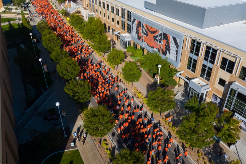 Student walking past the Rendezvous Center during New student convocation