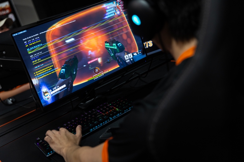 Student playing a first-person shooting game