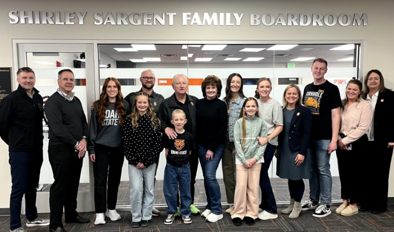 ISU Leadership celebrates the renovation of the Sargent Boardroom with John and Michelle Sargent and their family members. Sky Halter, ASISU president, is third from the right.
