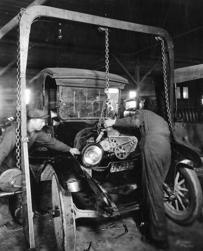 Lowering an engine into an automobile in 1922