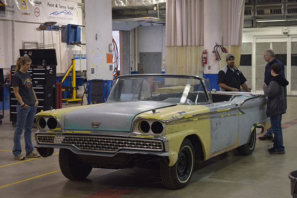 Students work on cars