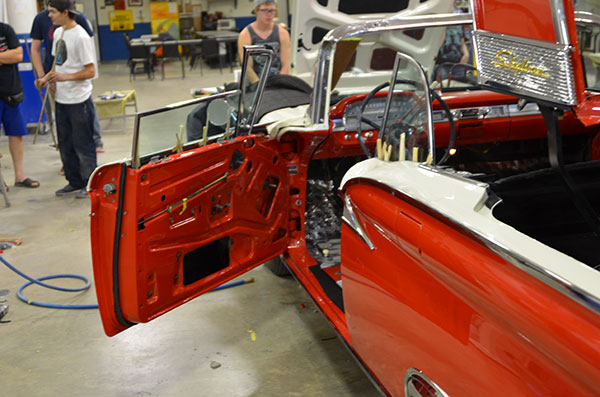 Students work on cars