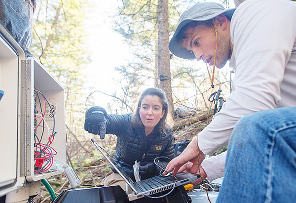 Sarah Godsey and student conducting river quality research