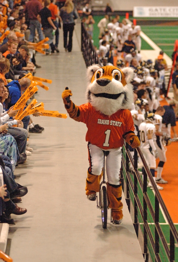 Benny on a unicycle during a basketball game