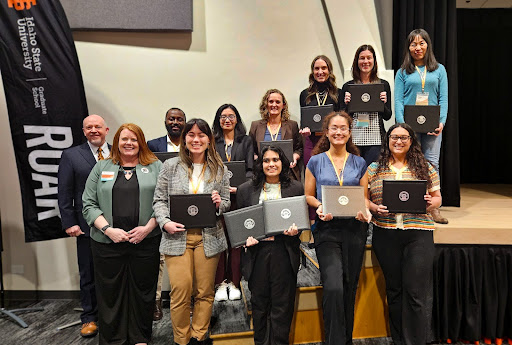 Research and Creative Works Symposium winners pose with Marty Blair, VP for research and Tracy Collum, associate dean for the graduate school in the SUB Ballroom on March 13, 2024