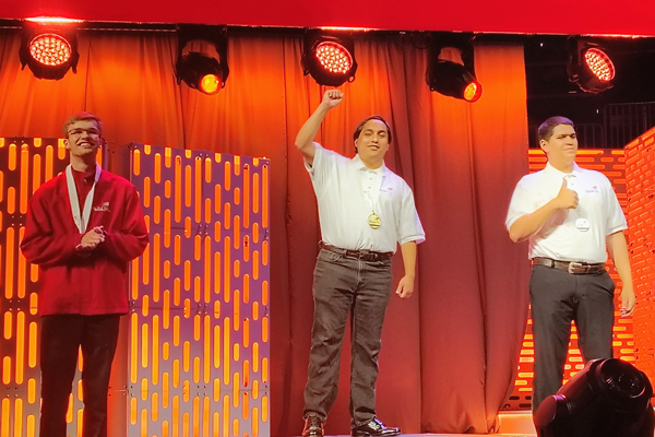 Angel Nava (center), ISU Robotics student and Gold medal recipient in Electronics Technology, at the SkillsUSA National Championship, Atlanta, Georgia.