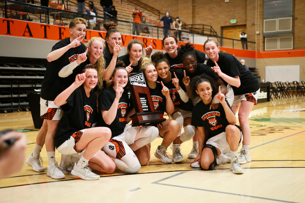 The ISU women's basketball team hoists the Big Sky trophy