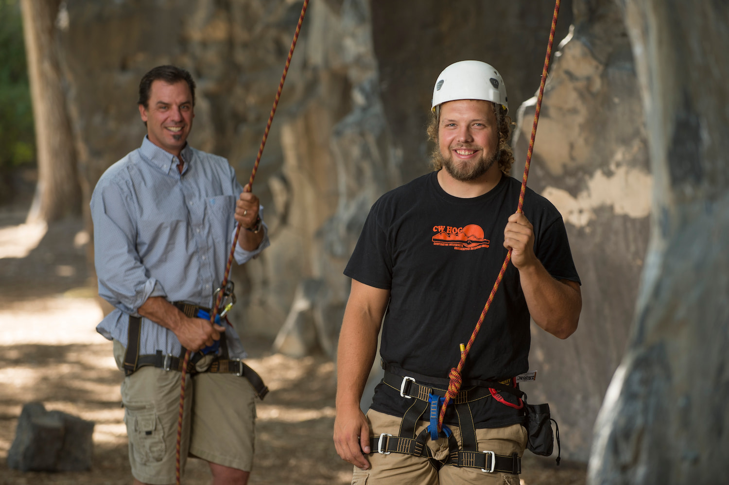 Two men harnessed up, ready to rock climb