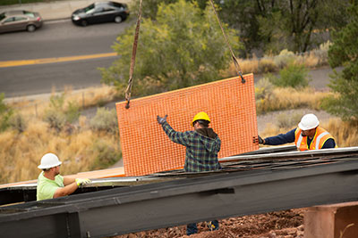 Compsite grating being placed on the frame