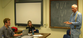 From left, ISU student Keith Lohse, ISU psychology professor Dr. Kandi Turley-Ames and the University of Texas's Dr. Michael Collins meet to discuss options.