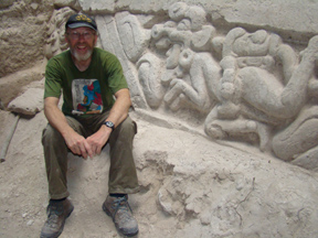 ISU graduate student Joseph Argyle next to one of the ancient Mayan panels he excavated.